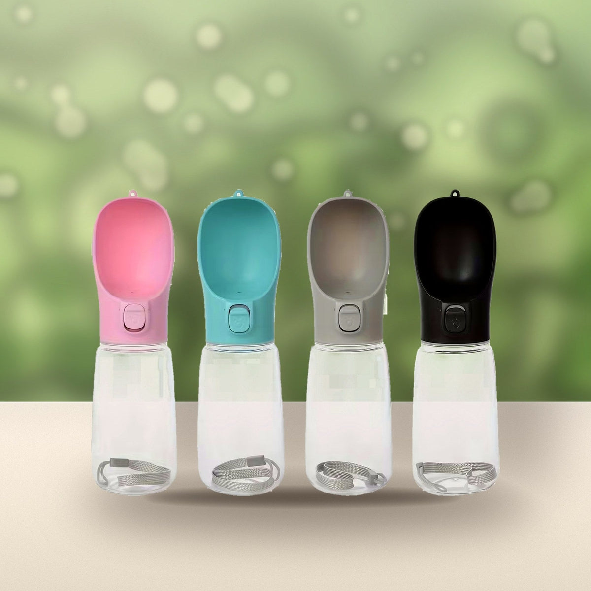 All four water bottle colours on a sunny garden table