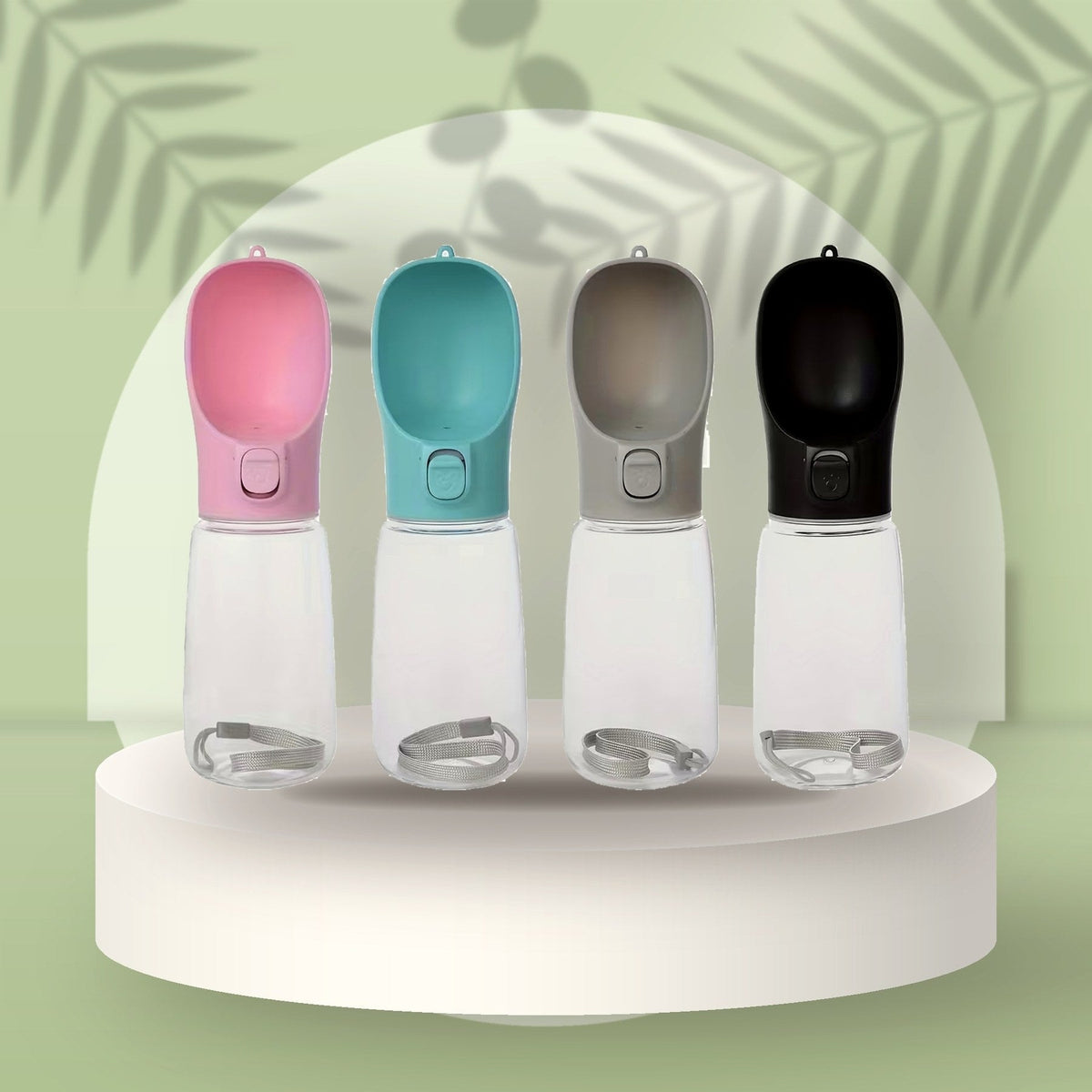 Portable Pet Water Bottle in pink, teal, grey and black on a sage podium