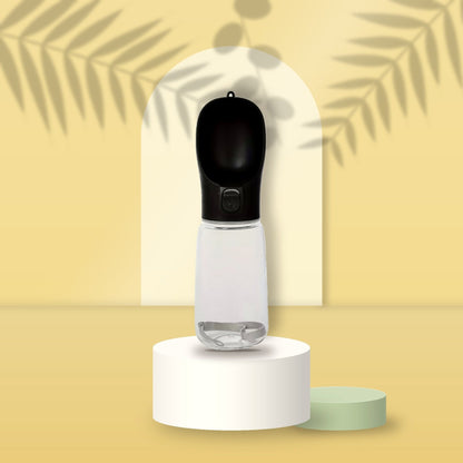 Black Portable Pet Water Bottle on a butter-yellow podium