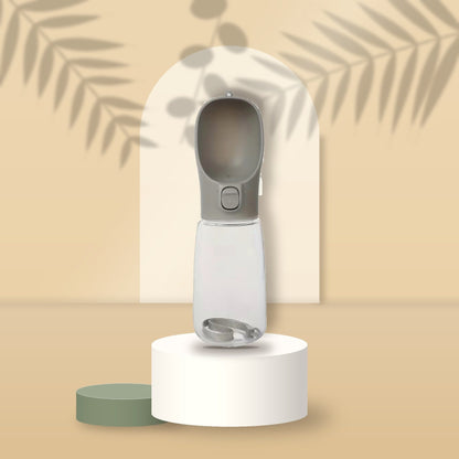 Grey Portable Pet Water Bottle on a sand podium