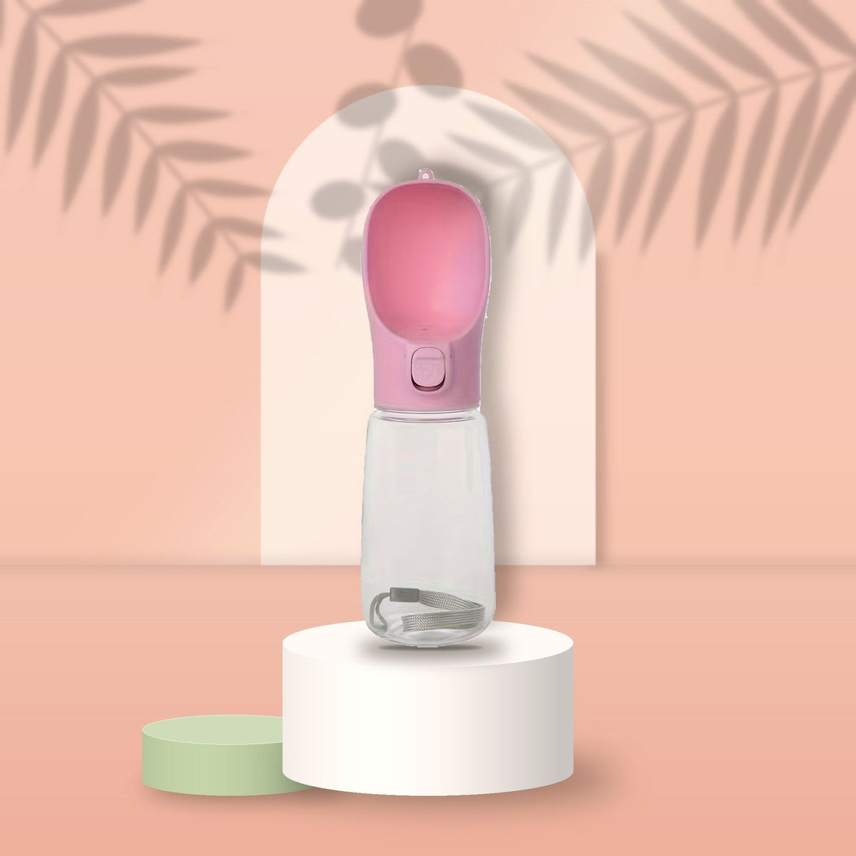Pink Portable Pet Water Bottle on a peach podium