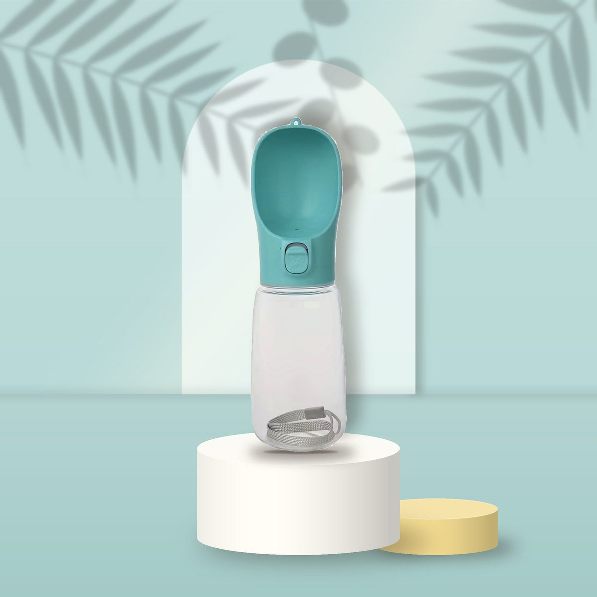 Teal Portable Pet Water Bottle on a sky-blue podium