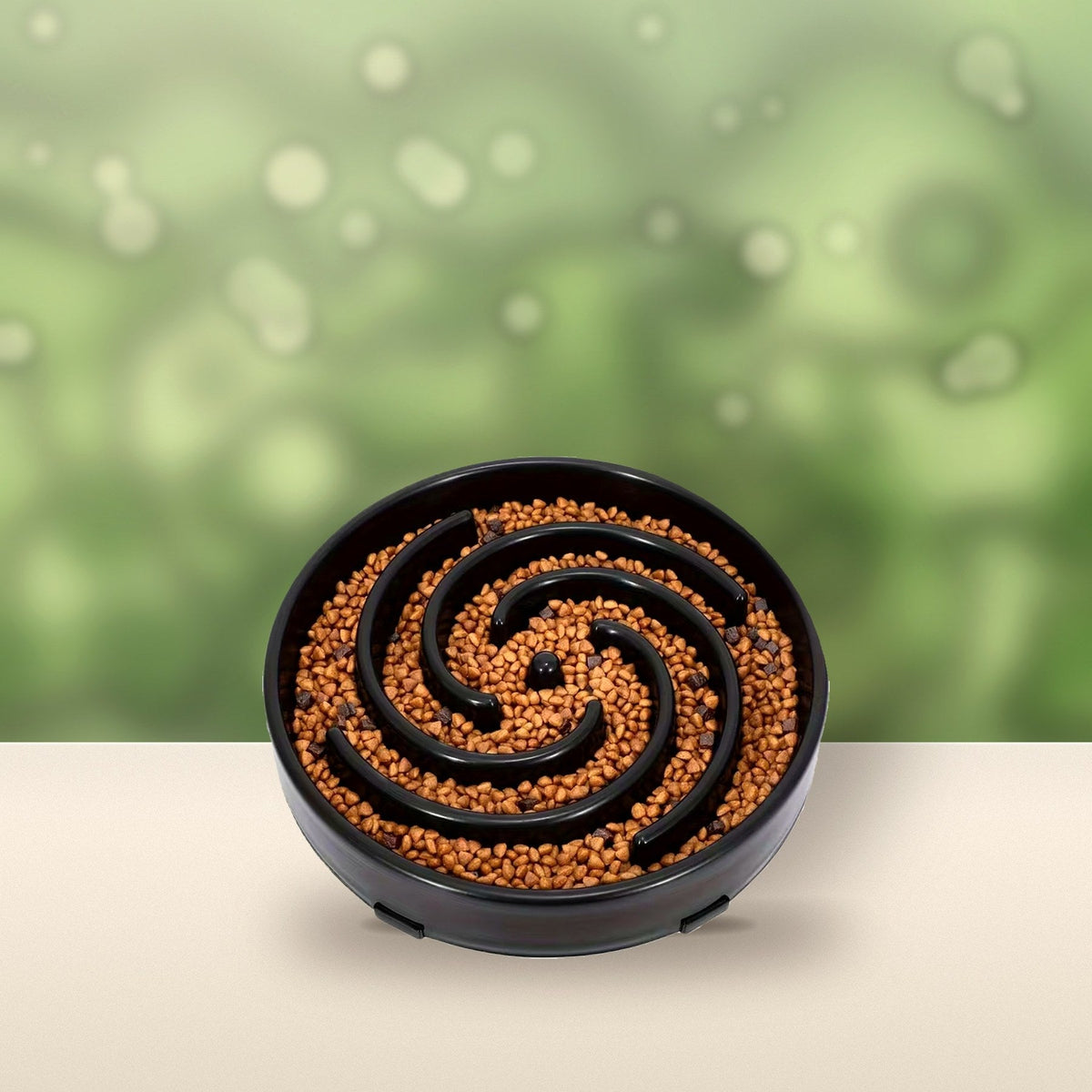 Black Spiral Slow Feeder Bowl on a sunny garden table